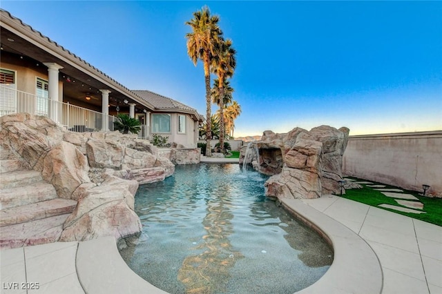 view of pool featuring stairs, fence, and a fenced in pool