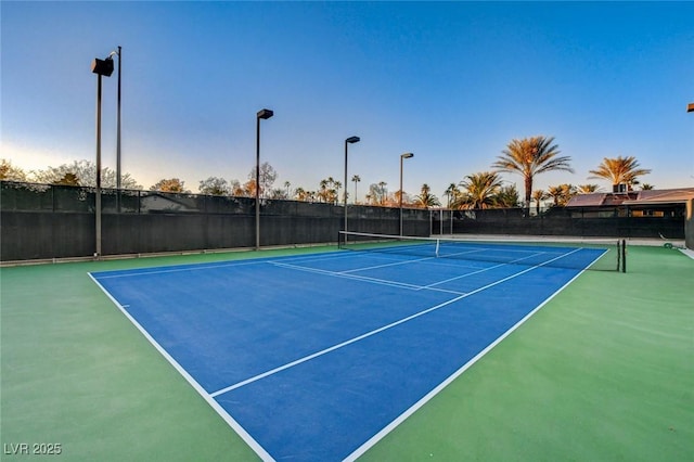 view of sport court with fence