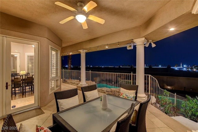 patio at twilight with ceiling fan, fence, and outdoor dining space