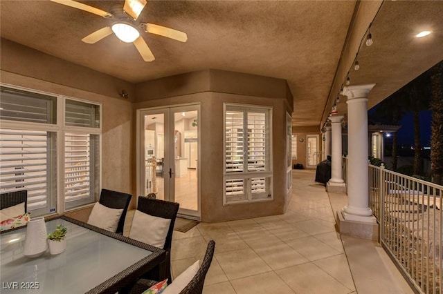 exterior space featuring a ceiling fan, outdoor dining space, and french doors