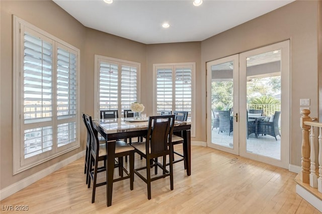 dining space featuring french doors, recessed lighting, light wood-style flooring, and baseboards