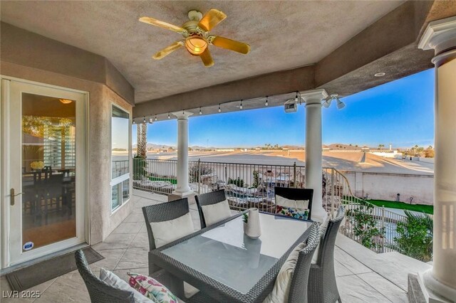 view of patio / terrace with outdoor dining area and a ceiling fan