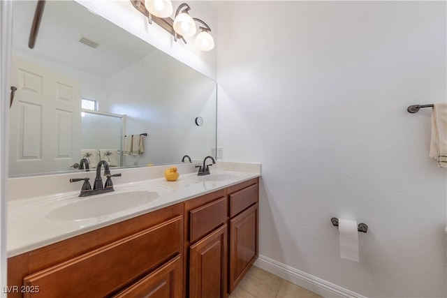 full bathroom featuring double vanity, tile patterned flooring, visible vents, and a sink