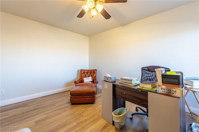 home office with a ceiling fan, baseboards, and wood finished floors