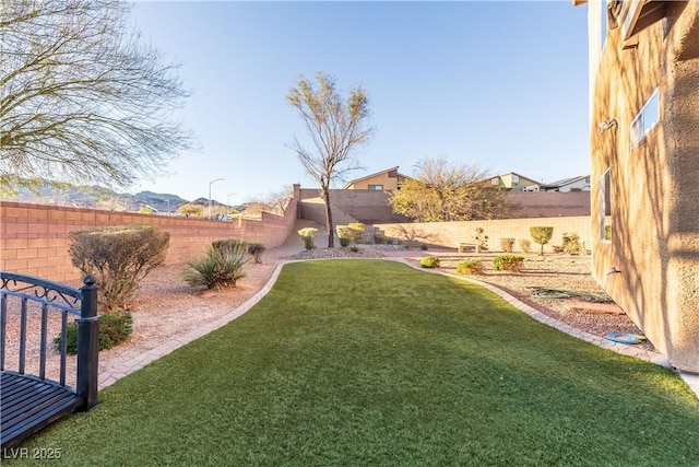 view of yard with a fenced backyard