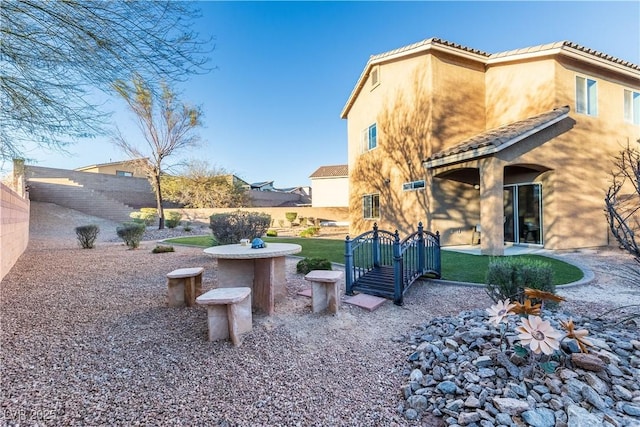 view of yard featuring fence and a patio