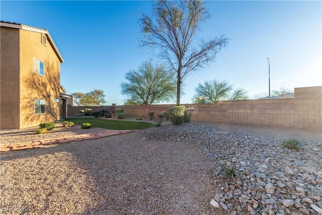 view of yard with a fenced backyard