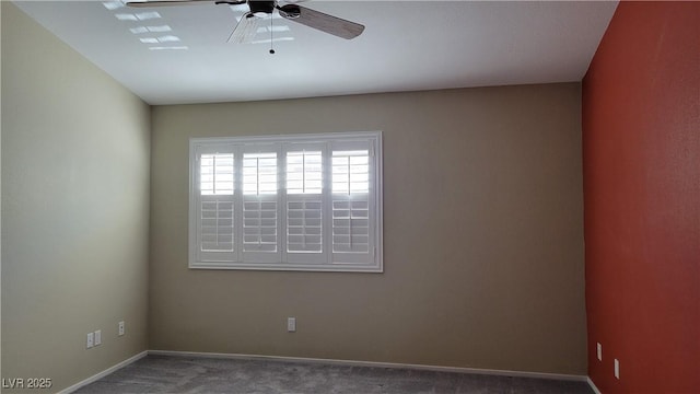 empty room featuring carpet, baseboards, and ceiling fan