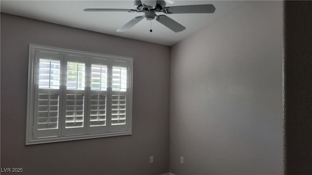 unfurnished room with ceiling fan