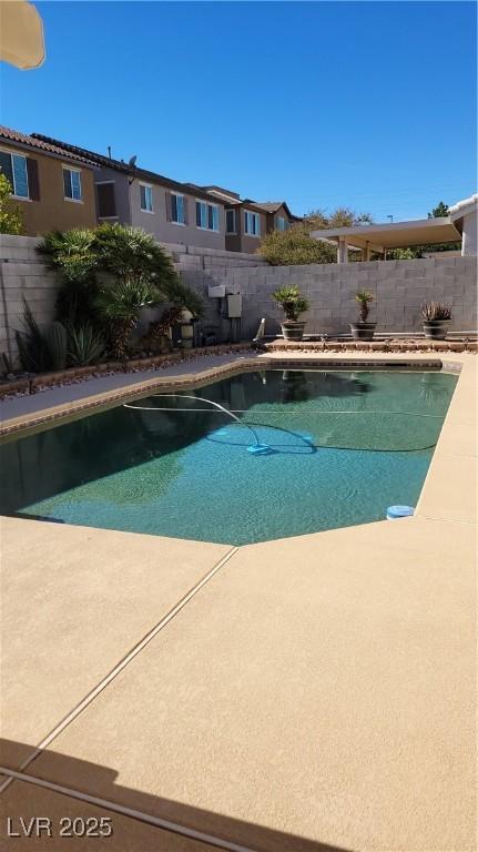 view of pool with a fenced backyard and a fenced in pool