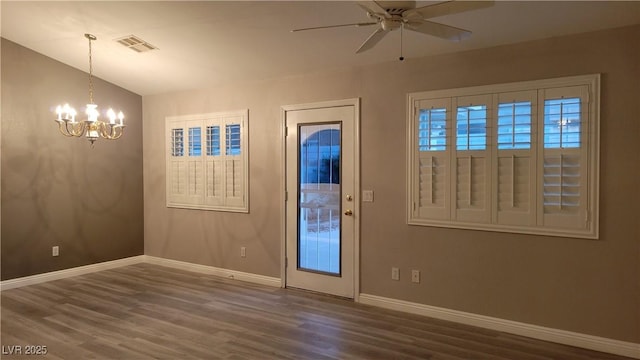 foyer featuring visible vents, baseboards, lofted ceiling, ceiling fan with notable chandelier, and wood finished floors