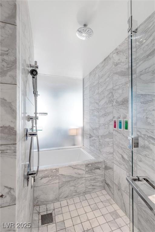 full bathroom featuring tiled shower and tiled bath