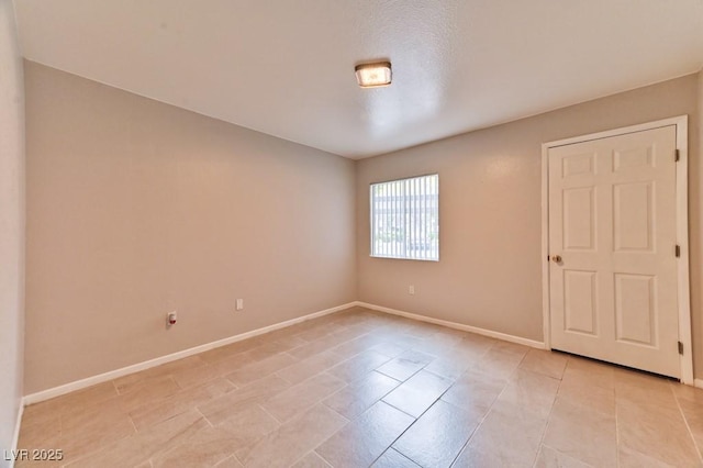 empty room with baseboards