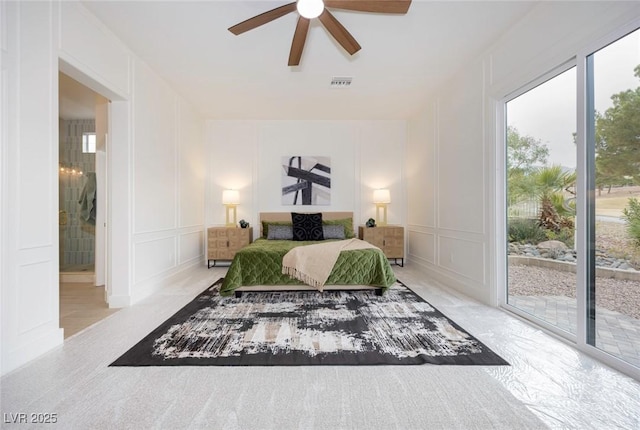 bedroom with a ceiling fan, access to outside, visible vents, and a decorative wall