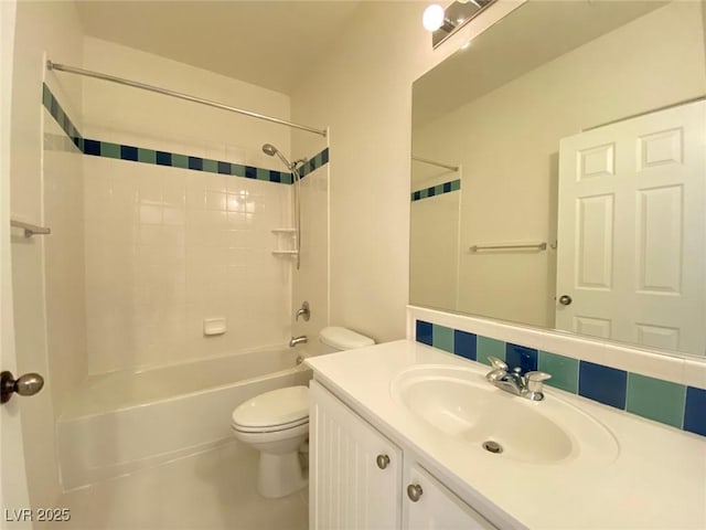 bathroom with washtub / shower combination, vanity, and toilet