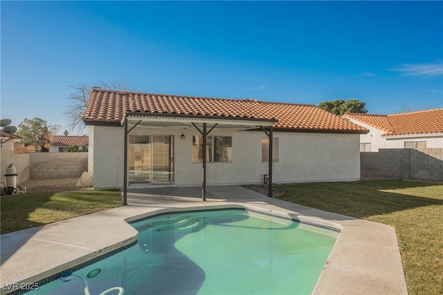 view of swimming pool featuring a patio, a lawn, a fenced backyard, and a fenced in pool