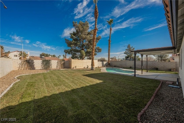 view of yard featuring a patio area, a fenced backyard, and a fenced in pool