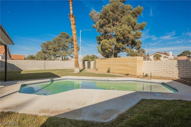 view of pool featuring a fenced in pool, a yard, a fenced backyard, and a patio