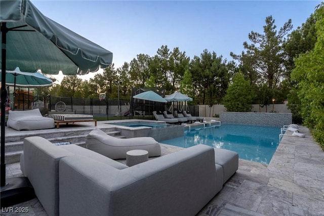 view of swimming pool featuring a patio area, a fenced backyard, an outdoor living space, and a fenced in pool