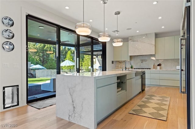 kitchen with light wood-type flooring, modern cabinets, and decorative backsplash