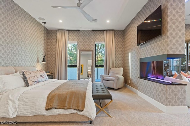 bedroom with wallpapered walls, visible vents, baseboards, access to exterior, and carpet