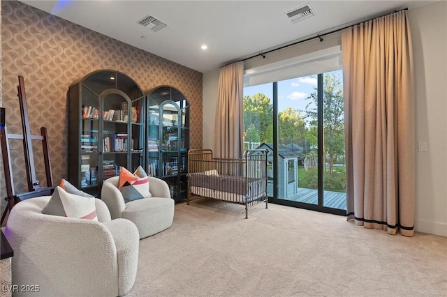 sitting room featuring carpet, visible vents, recessed lighting, and wallpapered walls