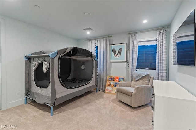 laundry room with recessed lighting, light colored carpet, and visible vents