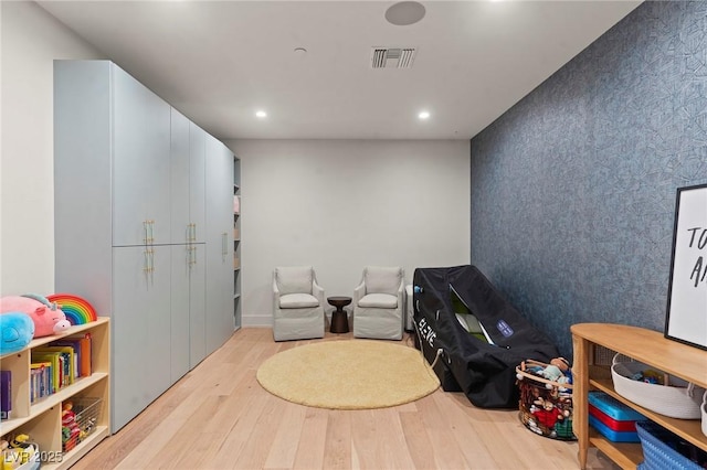 rec room featuring recessed lighting, visible vents, and wood finished floors