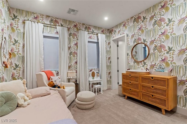 bedroom featuring visible vents, carpet flooring, and wallpapered walls