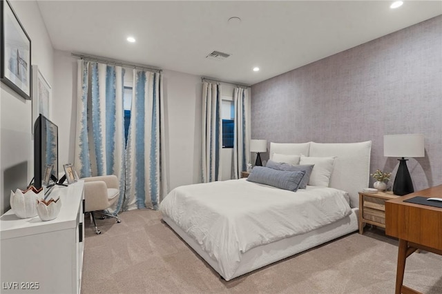 bedroom featuring recessed lighting, visible vents, light carpet, and wallpapered walls