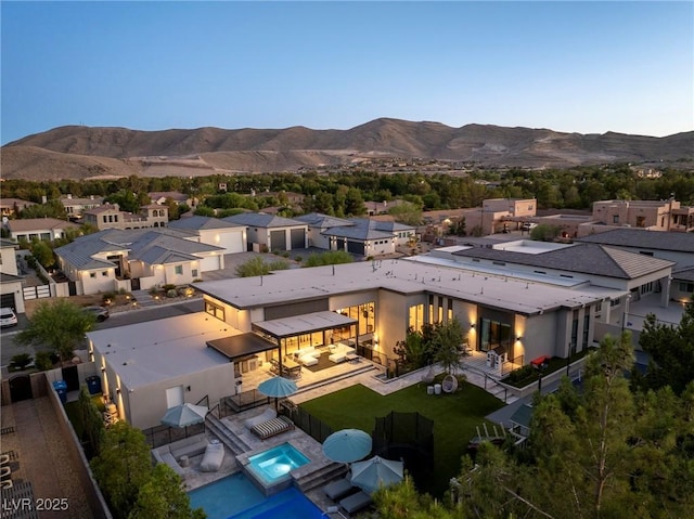 drone / aerial view with a residential view and a mountain view