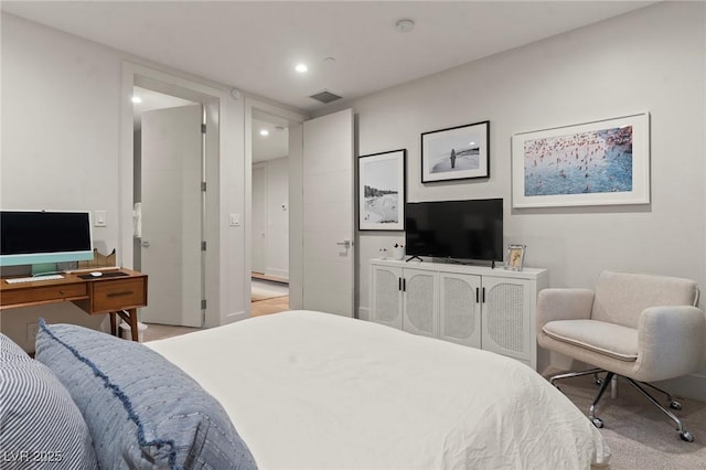 bedroom with recessed lighting, visible vents, and light carpet