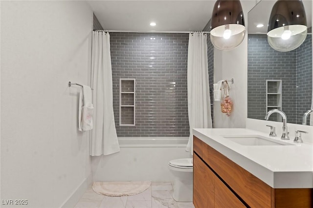 bathroom with marble finish floor, vanity, toilet, and shower / bath combo with shower curtain