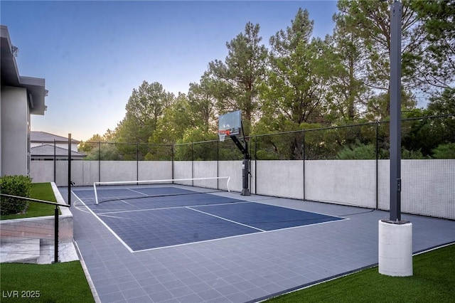 view of tennis court with fence