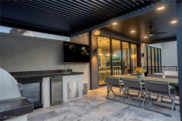 view of patio / terrace featuring ceiling fan, outdoor dining area, area for grilling, and a sink