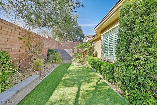 view of yard featuring a fenced backyard