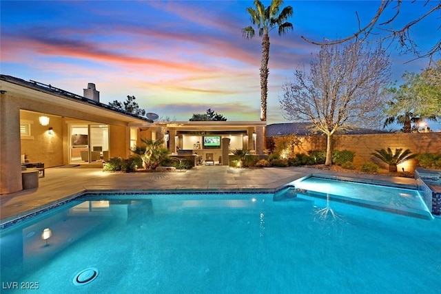 pool at dusk featuring a patio, fence, and a fenced in pool