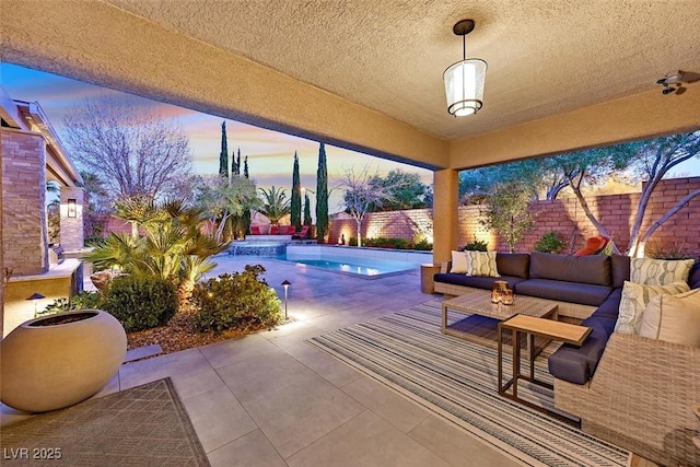 view of patio featuring a pool with connected hot tub, outdoor lounge area, and a fenced backyard