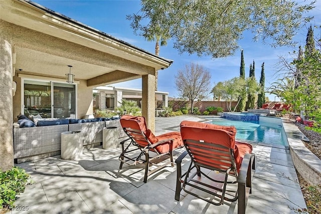 view of patio featuring a pool with connected hot tub, a fenced backyard, and an outdoor living space