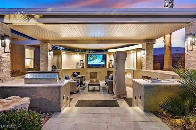 view of patio / terrace featuring exterior kitchen and an outdoor hangout area