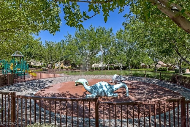 exterior space featuring playground community and fence