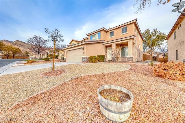 view of front of property with driveway and stucco siding