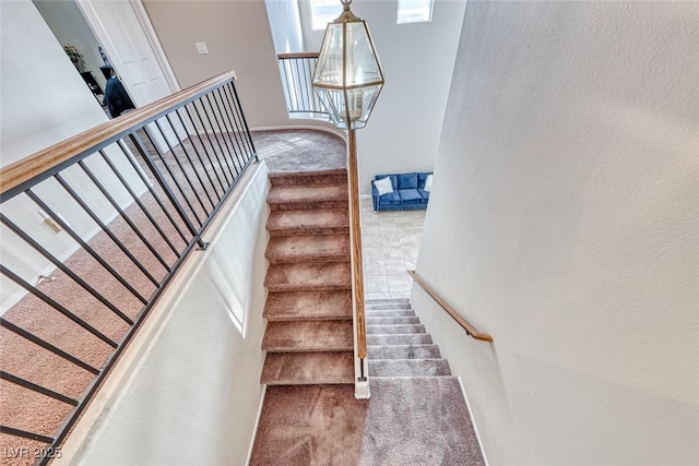 stairway featuring baseboards