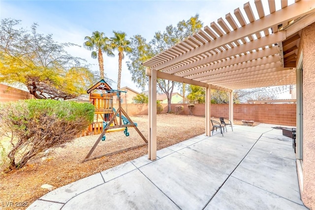 view of patio / terrace with a fenced backyard, a pergola, and a playground