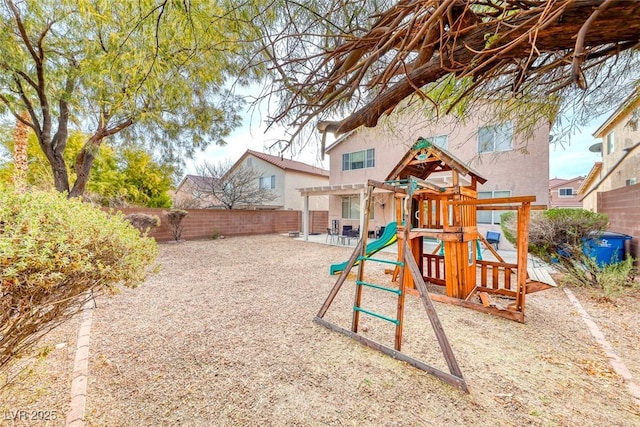 view of playground with a fenced backyard and a pergola