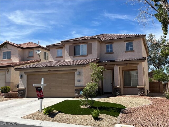 10332 George Hart Ct, Las Vegas, NV 89129 - mediterranean / spanish home with stucco siding, a tiled roof, driveway, and stone siding