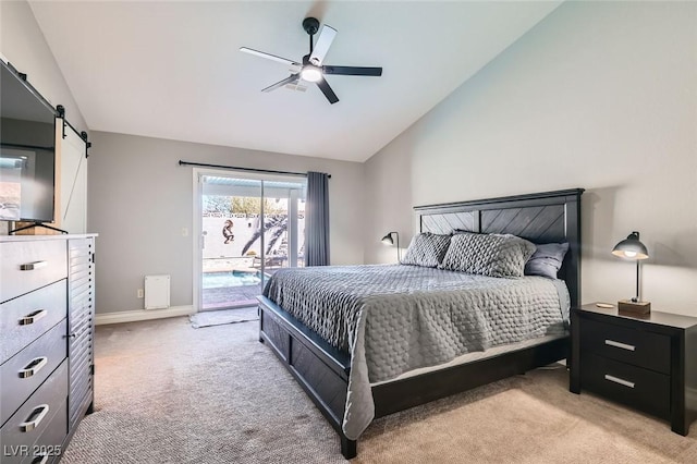 bedroom with ceiling fan, a barn door, light carpet, vaulted ceiling, and access to outside