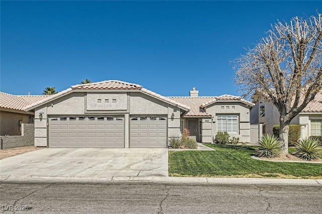 mediterranean / spanish house with a tile roof, a chimney, stucco siding, concrete driveway, and an attached garage