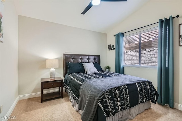 bedroom with lofted ceiling, carpet, baseboards, and a ceiling fan