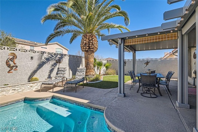 view of swimming pool with a patio area, a fenced backyard, outdoor dining area, and a fenced in pool